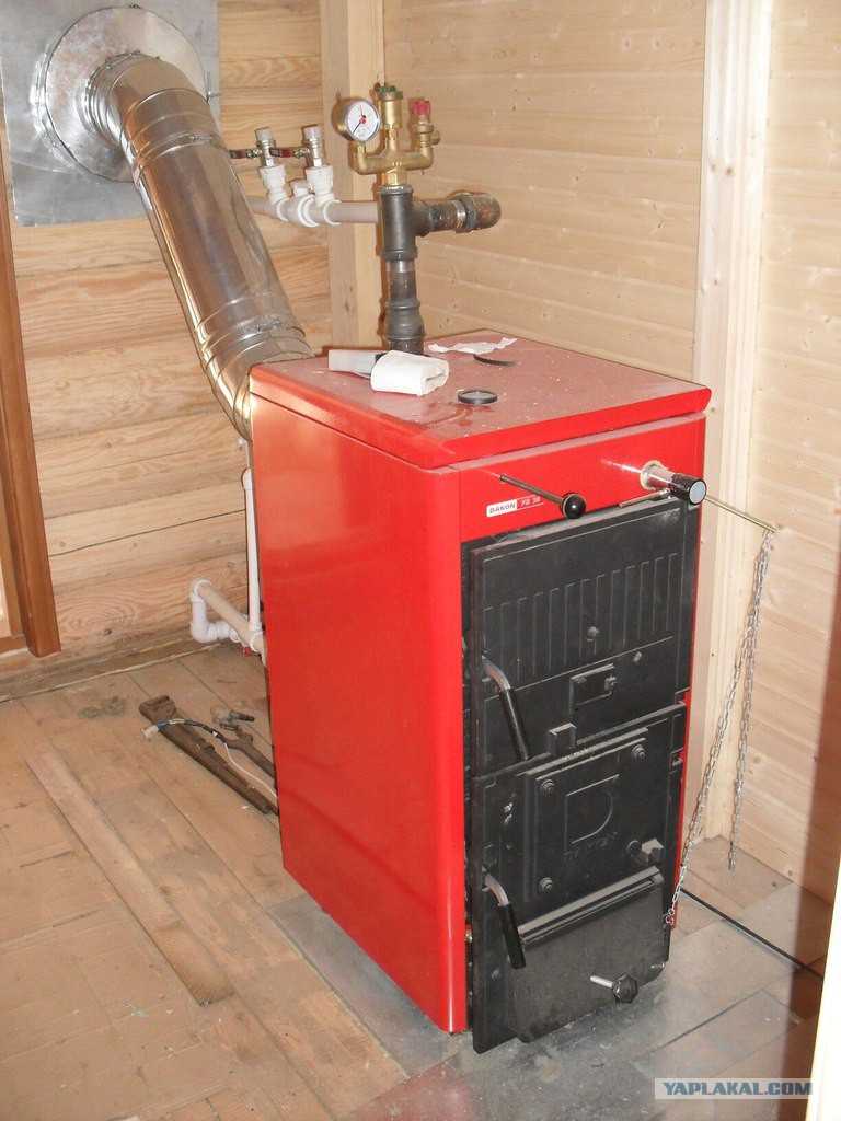 Дровяной котел длительного горения для отопления частного дома с водяным контуром